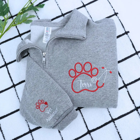 Custom embroidered quarter zip vet tech sweatshirt with personalized name and sleeve text