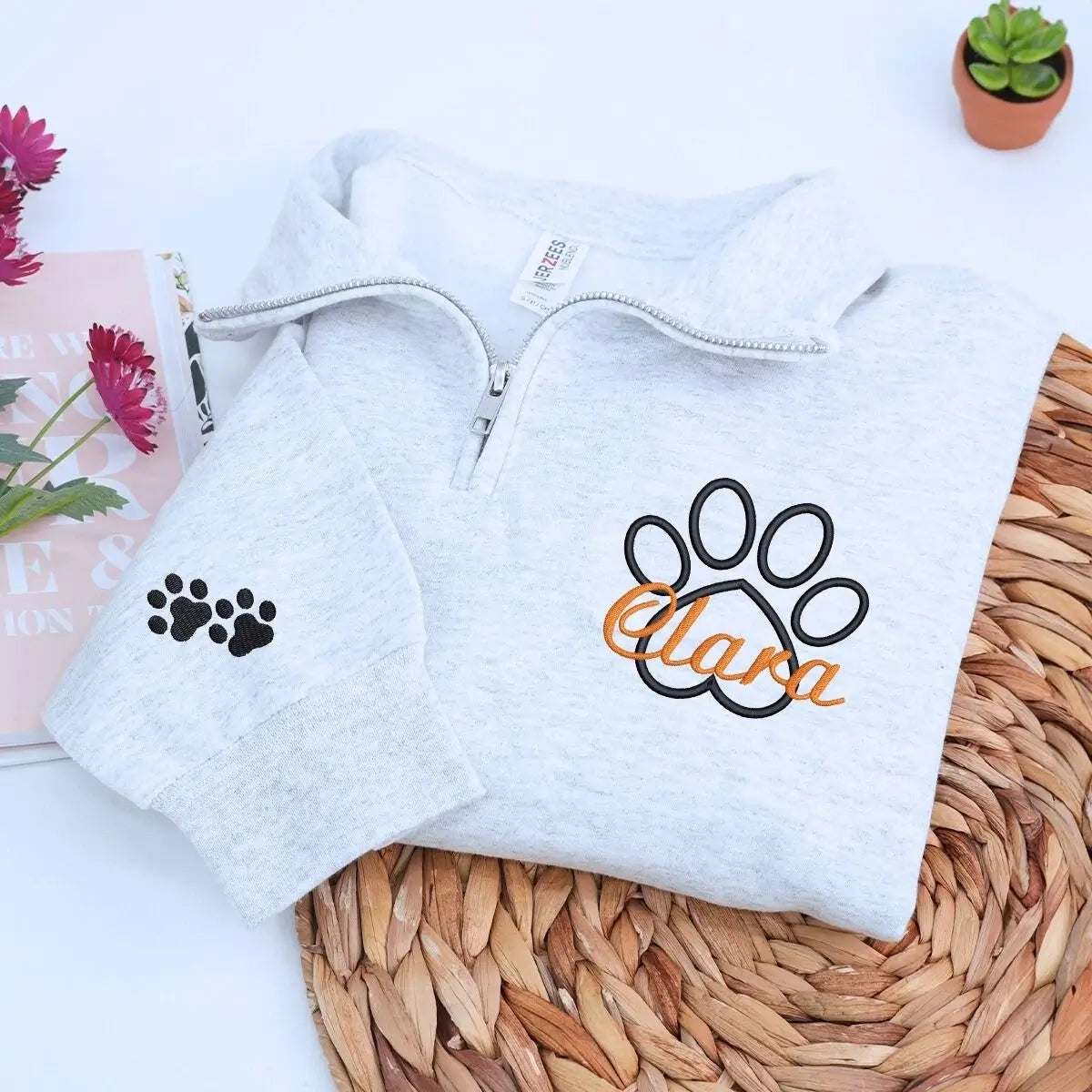Custom embroidered veterinarian sweatshirt with paw print and name on chest