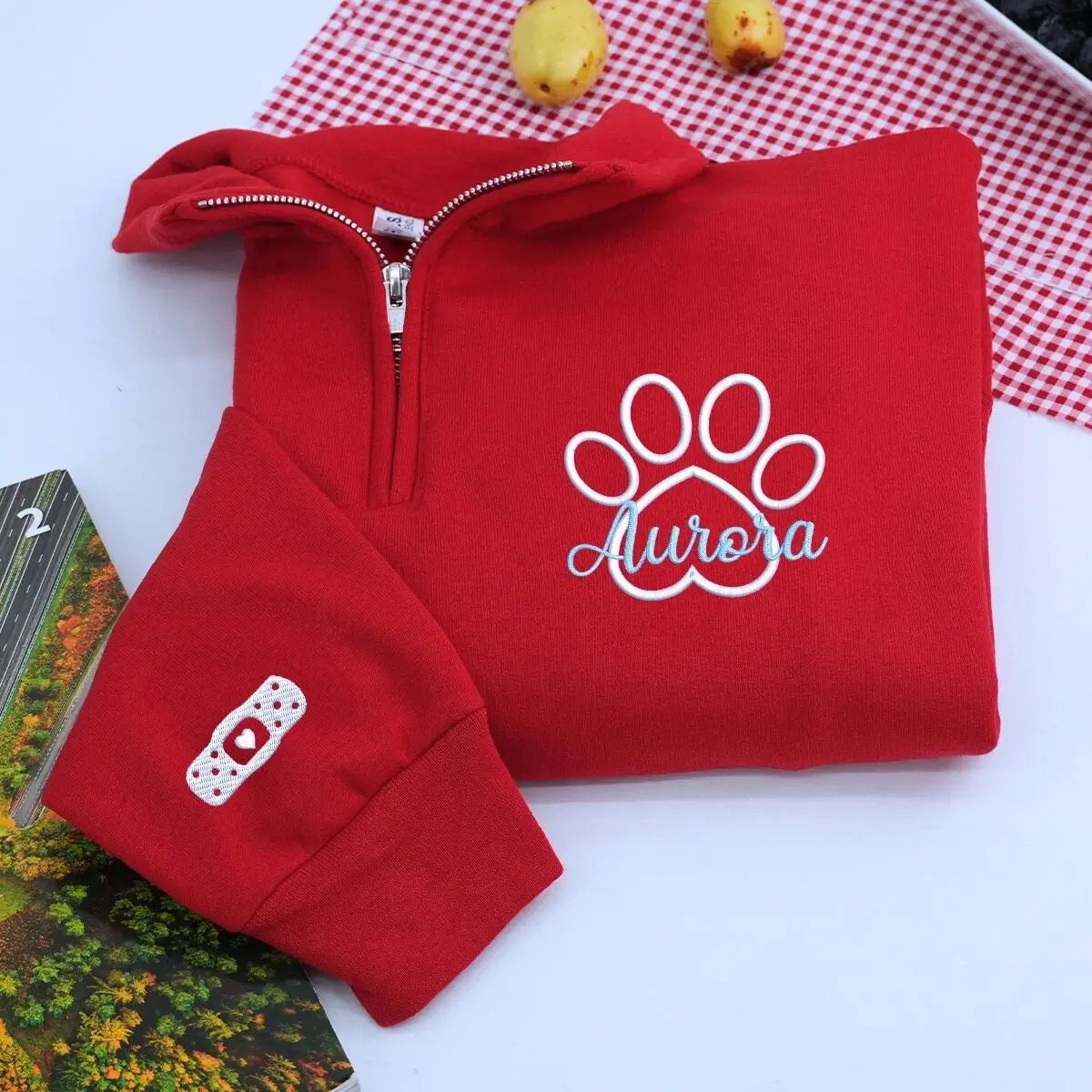 Custom embroidered veterinarian sweatshirt with paw print and name on chest