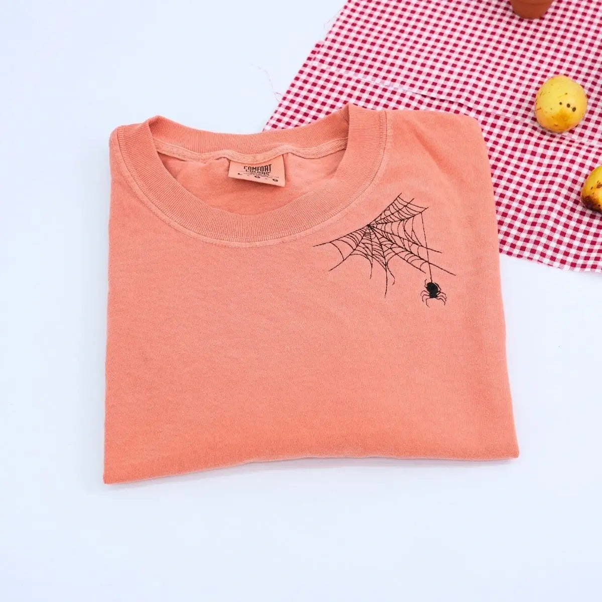 Embroidered bat Halloween t-shirt on neckline, Comfort Colors cotton in fall-inspired tones