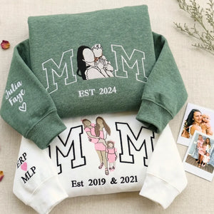 Green and white MOM sweatshirts with embroidered mother-child portrait, kids' names and est. year on sleeve