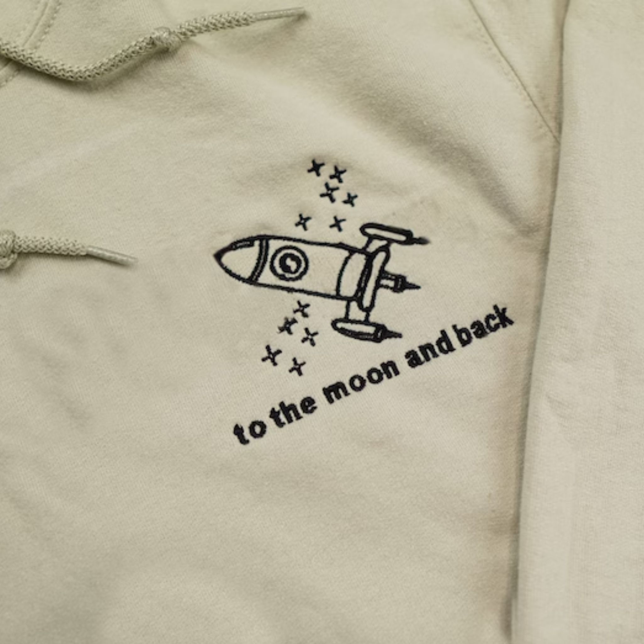 https://embroly.com/cdn/shop/files/embroidered-space-and-moon-matching-couple-hoodie-unique-gift-for-newly-married-couple_5000x.jpg?v=1682669713