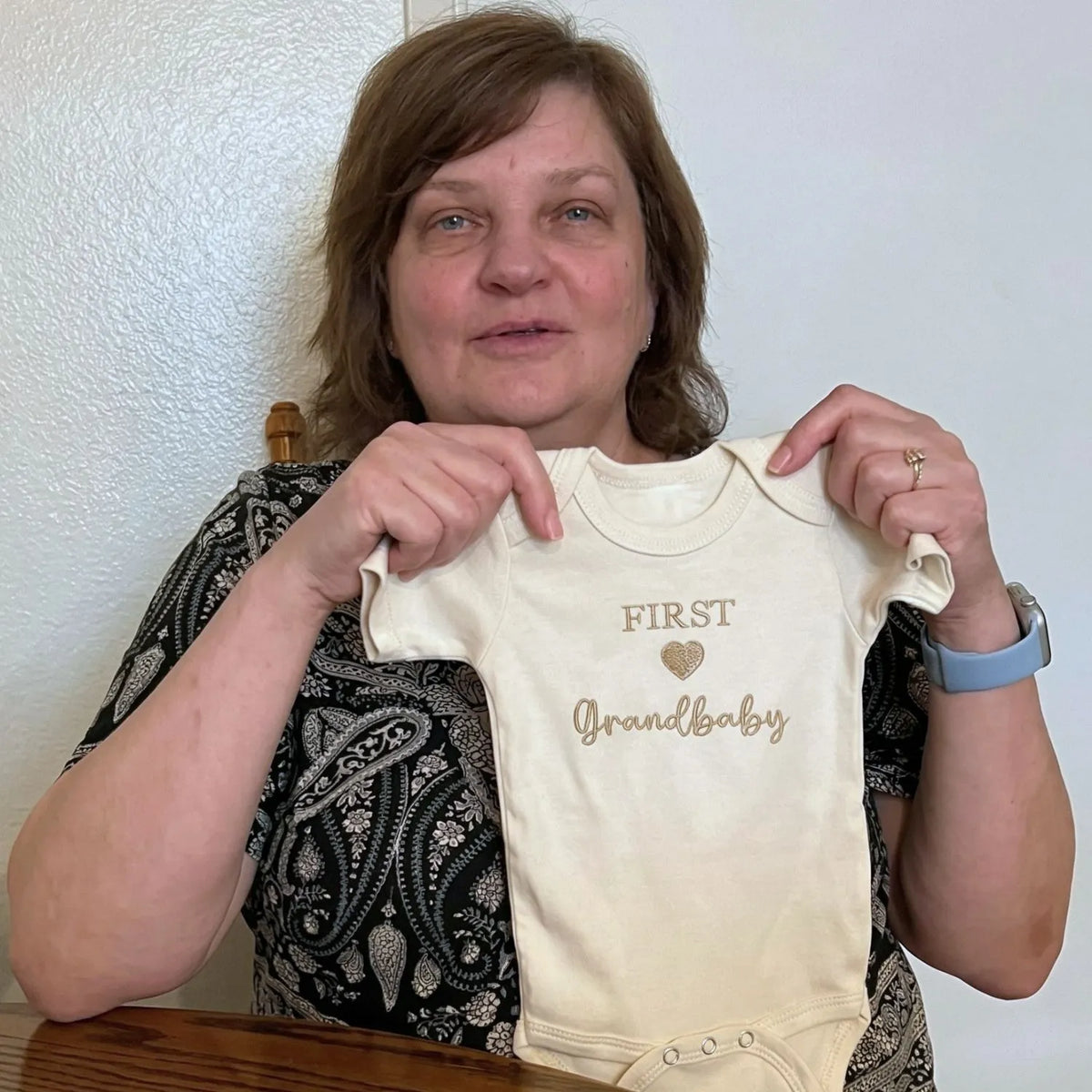 Soft embroidered newborn onesie announcing first grandbaby – perfect first-time grandparents gift
