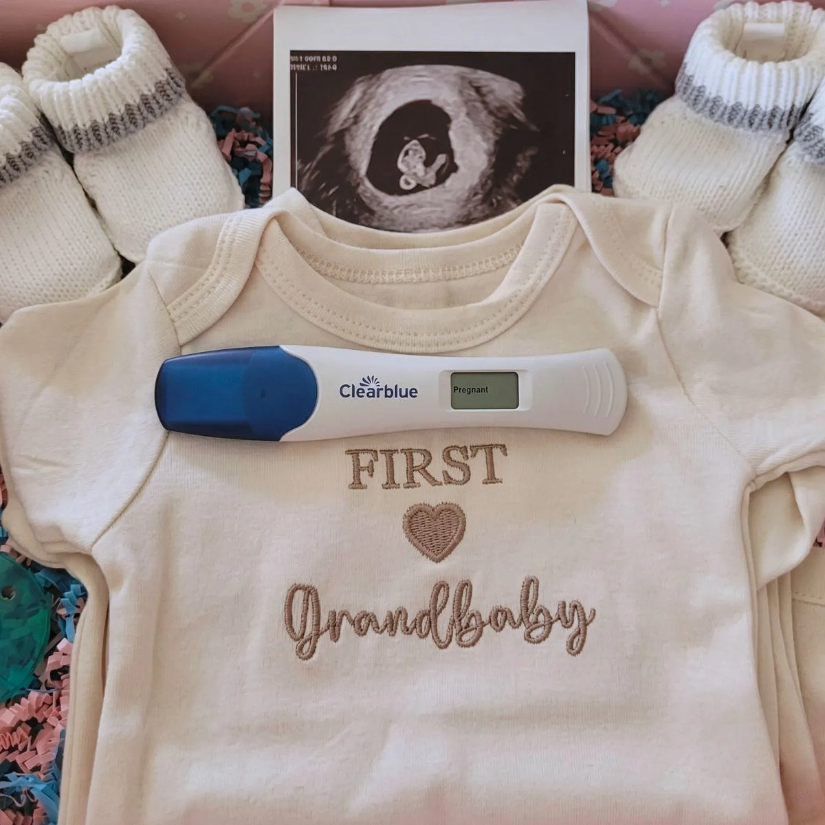 Soft embroidered newborn onesie announcing first grandbaby – perfect first-time grandparents gift