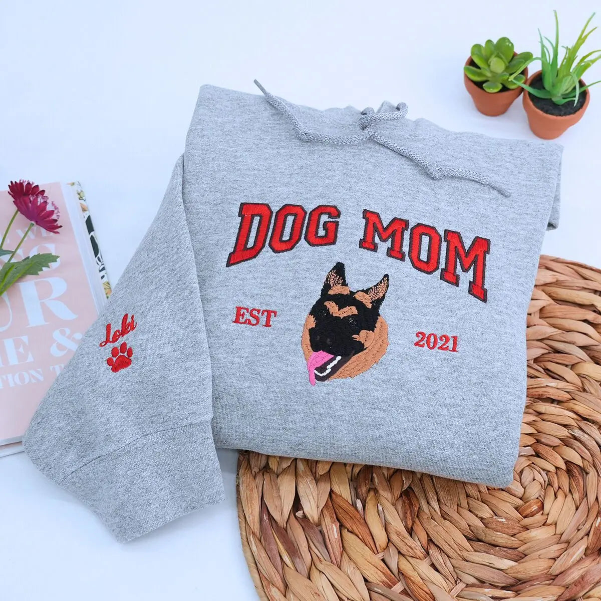 Custom embroidered hoodie featuring a realistic German Shepherd portrait with name on sleeve