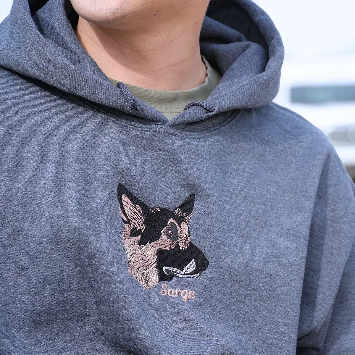 Custom embroidered hoodie featuring a realistic German Shepherd portrait with name on sleeve