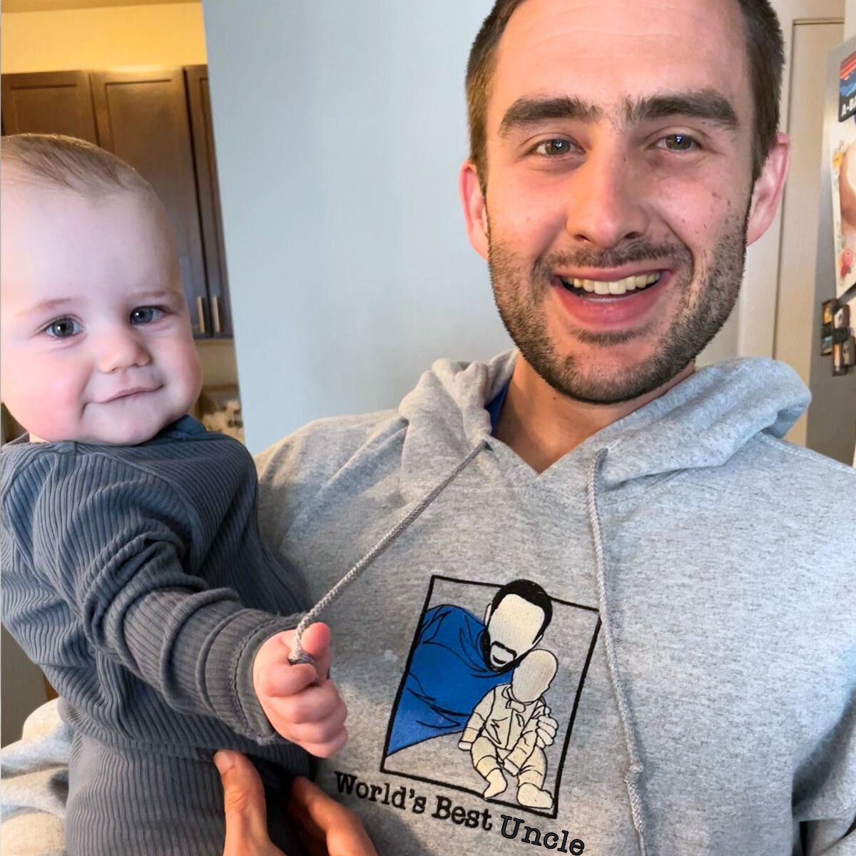 Gray embroidered 'Uncle EST. 2024' hoodie, a thoughtful and cozy gift for new uncles.