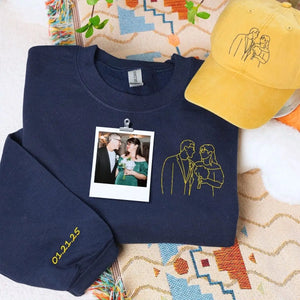 His and hers embroidered sweatshirt and hat set displayed side by side on neutral background