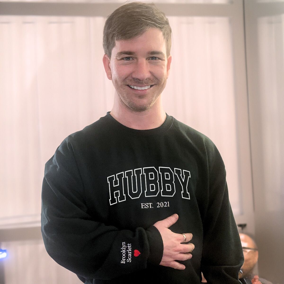 Black 'Hubby Est. 2021' sweatshirt with custom sleeve embroidery, a perfect anniversary or wedding gift for husbands.