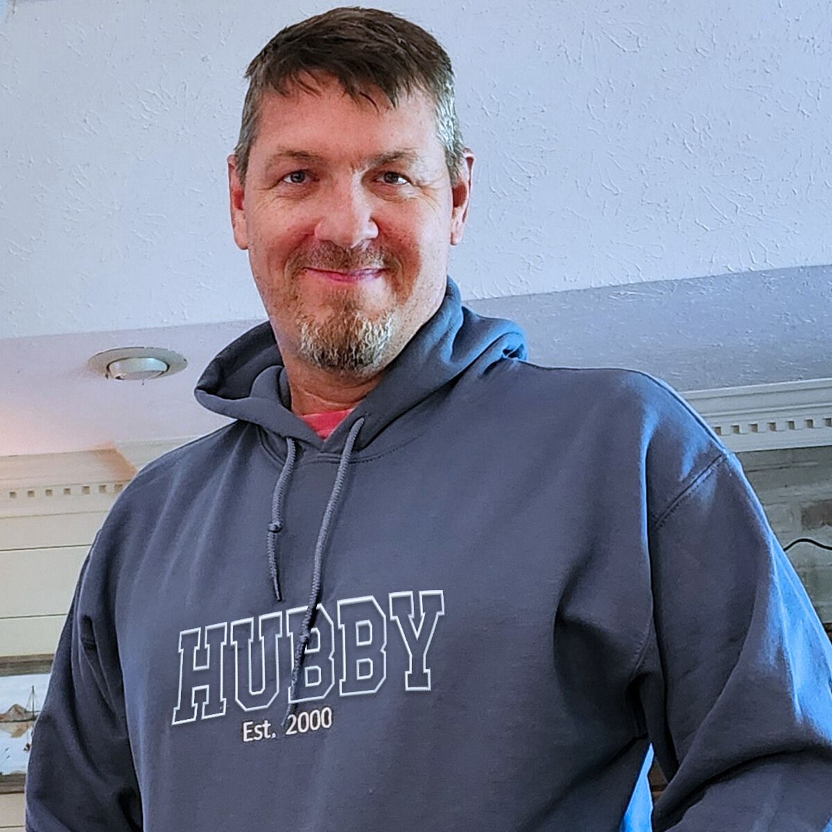 Navy 'Hubby EST. 2000' hoodie with custom embroidery, a warm and stylish anniversary or wedding gift for husbands.