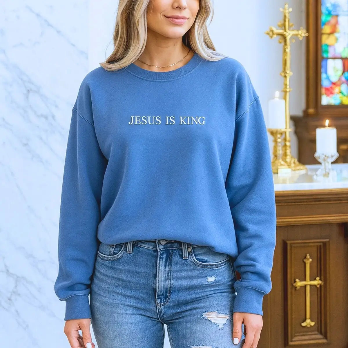 Custom embroidered Jesus Is King sweatshirt with personalized sleeve text