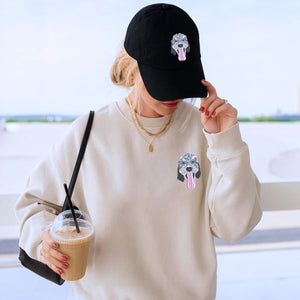 Dog lover wearing matching sweatshirt and hat set featuring pet-themed design