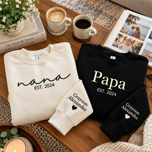 Matching sand Nana and black Papa embroidered sweatshirts with personalized grandkids names on sleeves, perfect for grandparents gifts, birthdays, Christmas, Grandparents Day, and family celebrations.