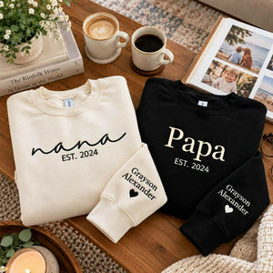 Matching sand Nana and black Papa embroidered sweatshirts with personalized grandkids names on sleeves, perfect for grandparents gifts, birthdays, Christmas, Grandparents Day, and family celebrations.