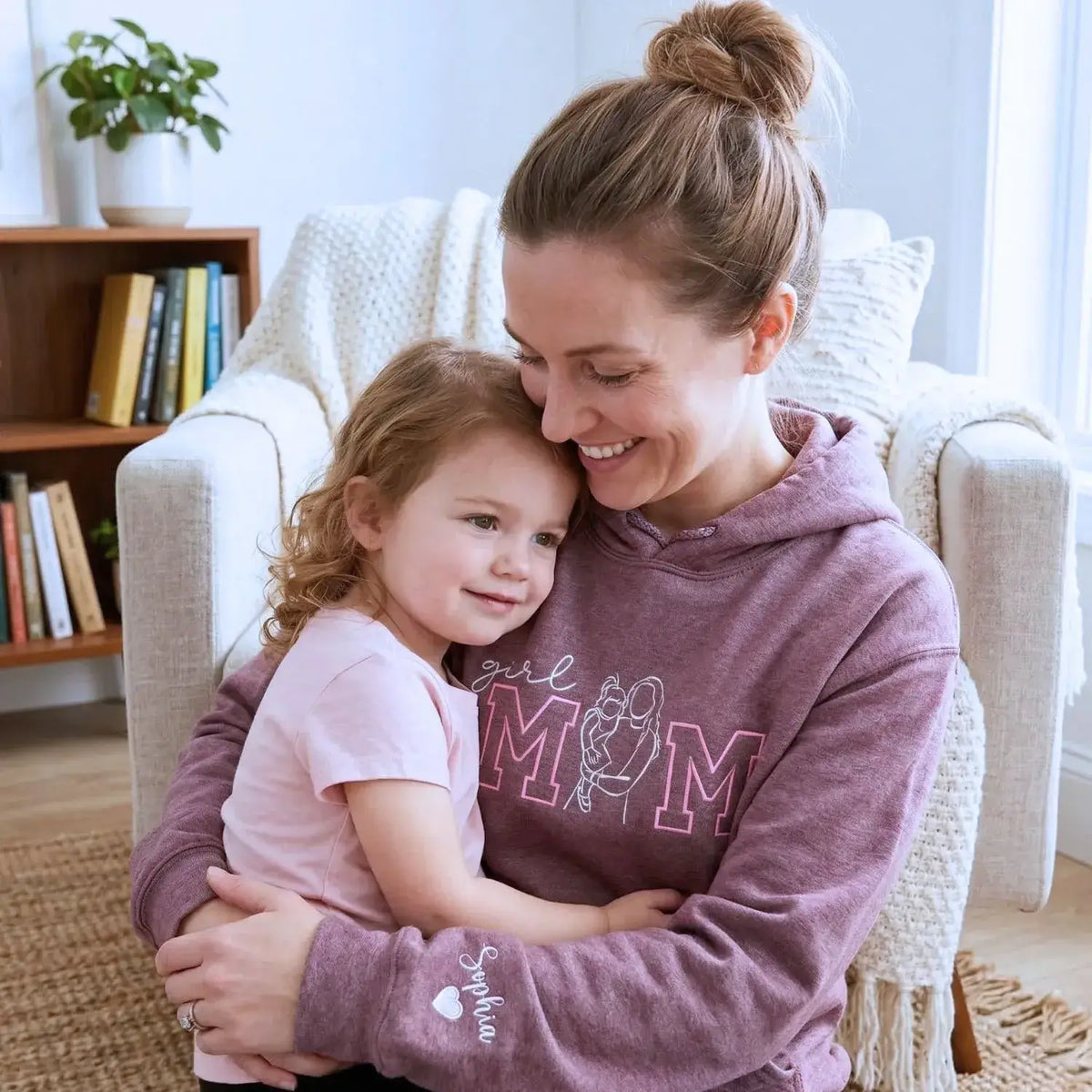 Custom embroidered mom hoodie with portrait from photo and kids names design on sweatshirt front detail