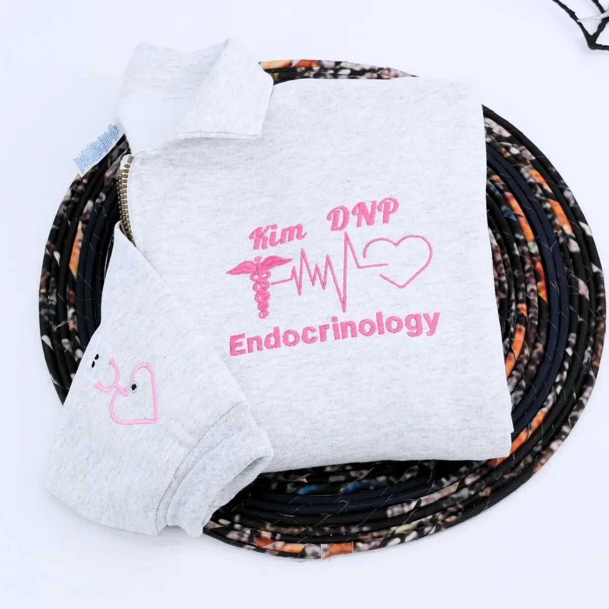 Custom embroidered quarter zip sweatshirt with nurse’s name, perfect gift for healthcare workers