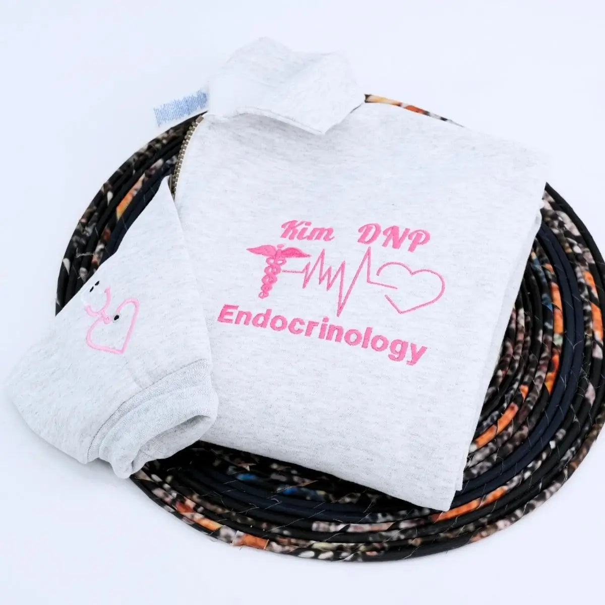 Custom embroidered quarter zip sweatshirt with nurse’s name, perfect gift for healthcare workers