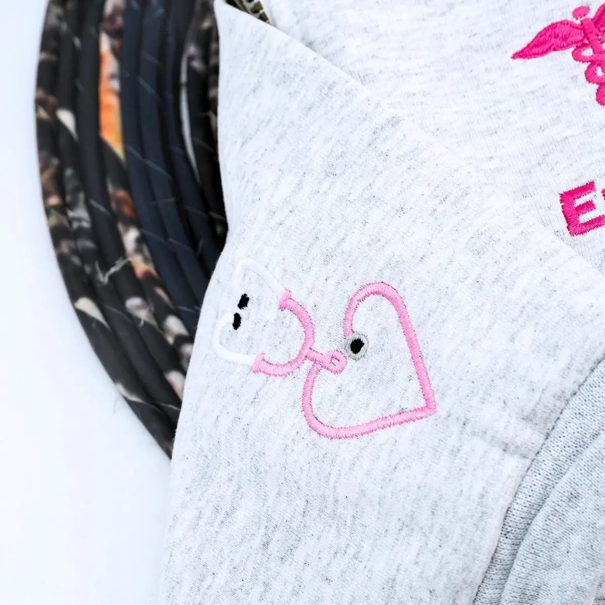 Custom embroidered quarter zip sweatshirt with nurse’s name, perfect gift for healthcare workers