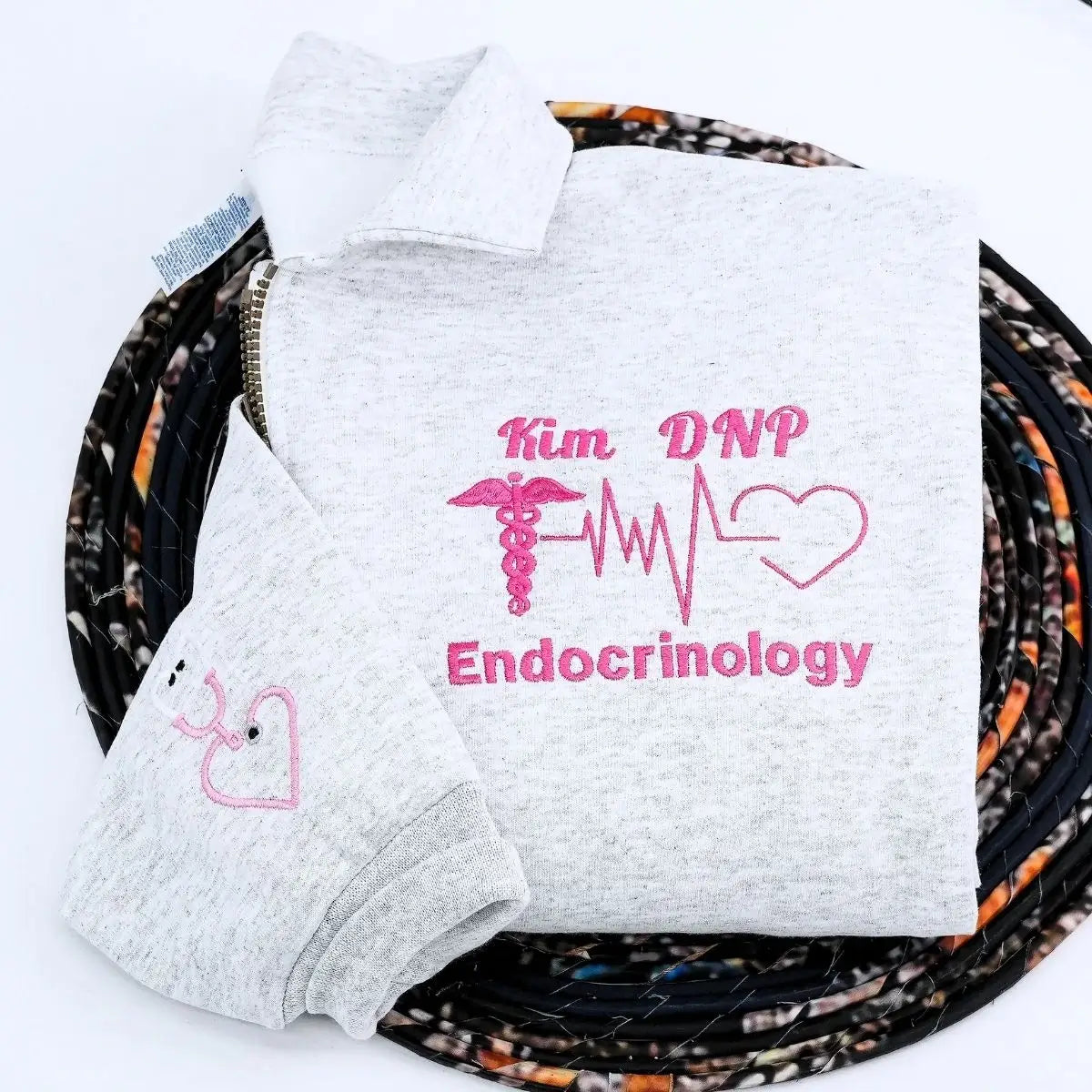 Custom embroidered quarter zip sweatshirt with nurse’s name, perfect gift for healthcare workers