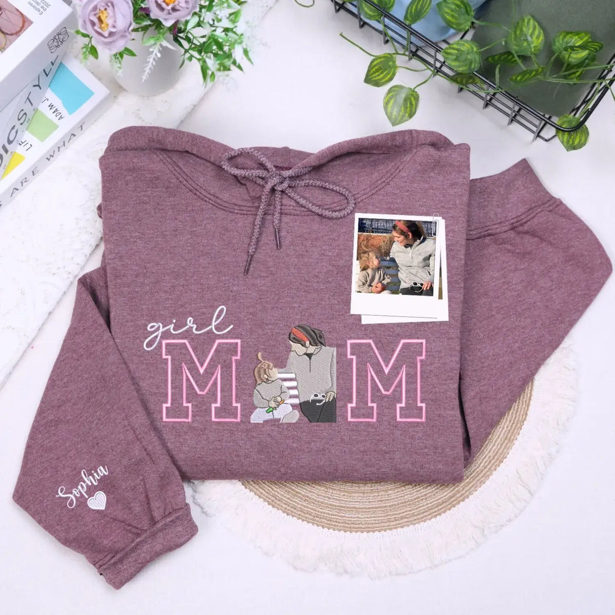 Custom embroidered mom hoodie with portrait from photo and kids names design on sweatshirt front detail