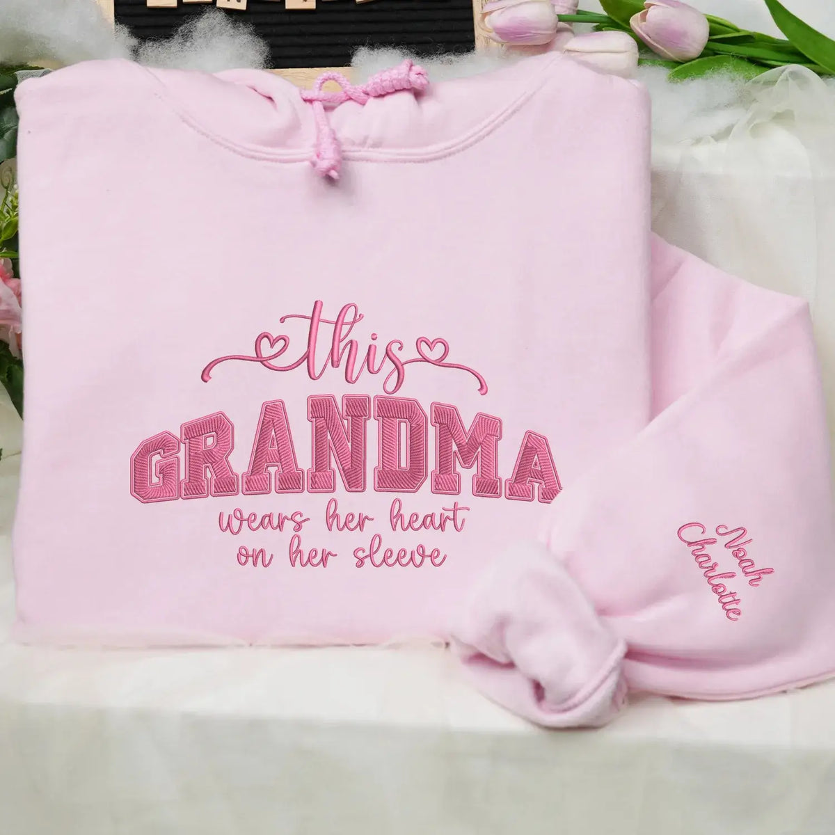 Personalized sweatshirt for grandma with embroidered “This Grandma Wears Her Heart on Her Sleeve” design