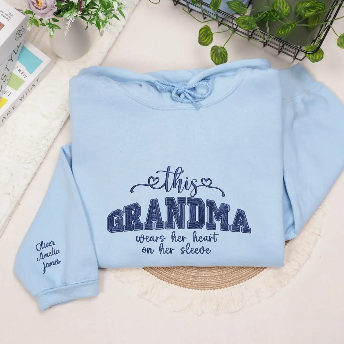 Personalized sweatshirt for grandma with embroidered “This Grandma Wears Her Heart on Her Sleeve” design