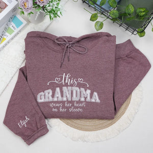 Personalized sweatshirt for grandma with embroidered “This Grandma Wears Her Heart on Her Sleeve” design