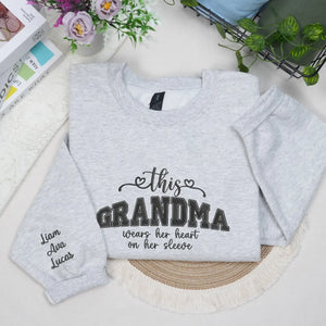 Personalized sweatshirt for grandma with embroidered “This Grandma Wears Her Heart on Her Sleeve” design