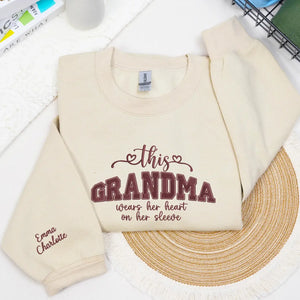 Personalized sweatshirt for grandma with embroidered “This Grandma Wears Her Heart on Her Sleeve” design