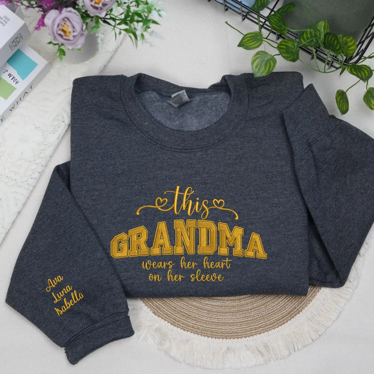 Personalized sweatshirt for grandma with embroidered “This Grandma Wears Her Heart on Her Sleeve” design