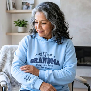 Personalized sweatshirt for grandma with embroidered “This Grandma Wears Her Heart on Her Sleeve” design