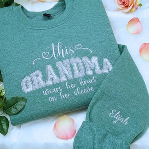 Personalized sweatshirt for grandma with embroidered “This Grandma Wears Her Heart on Her Sleeve” design