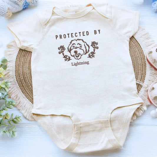 personalized baby onesie with embroidered dog portrait from photo for newborn announcement