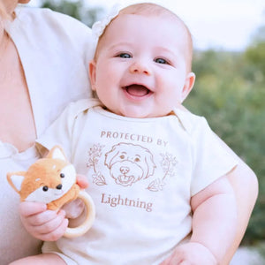 personalized baby onesie with embroidered dog portrait from photo for newborn announcement