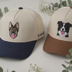 Close-up video of an embroidered dog-portrait snapback, a hand gently touching the fabric and stitch detail, soft background music
