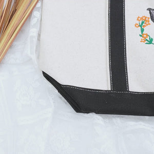 Dog lover combo gift with embroidered sweatshirt and matching tote bag – perfect cozy gift set for dog moms and pet owners.