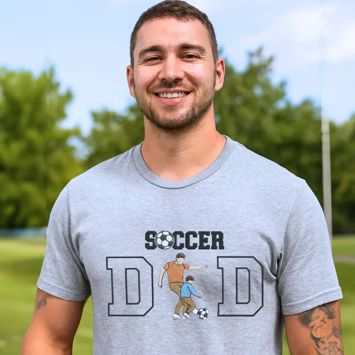 Custom embroidered soccer dad shirt with photo portrait on chest and child’s name on sleeve.