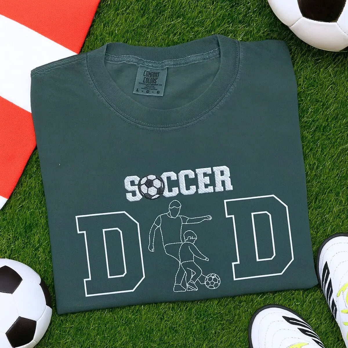 Custom embroidered soccer dad shirt with photo portrait on chest and child’s name on sleeve.