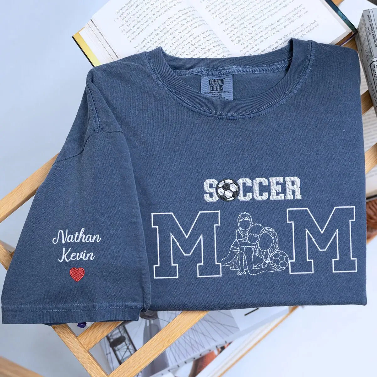 Custom embroidered soccer mom shirt with stitched child photo and sleeve text, perfect for game day pride