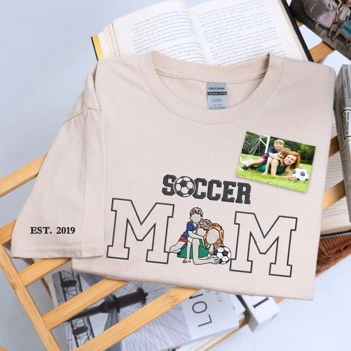 Custom embroidered soccer mom shirt with stitched child photo and sleeve text, perfect for game day pride