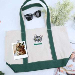 Cat-themed gift set including sweatshirt, tote bag, and hat displayed on a cozy background