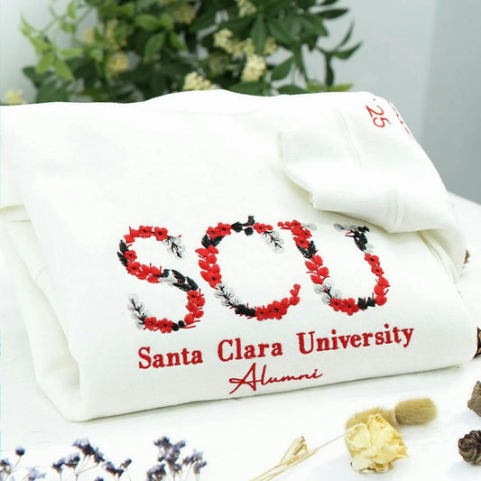 A white soft college spirit sweatshirt with floral embroidery, made for graduation photos, alumni memories, sorority moments, and everyday campus pride