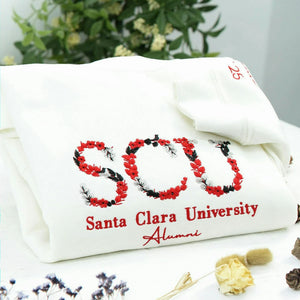 A white soft college spirit sweatshirt with floral embroidery, made for graduation photos, alumni memories, sorority moments, and everyday campus pride