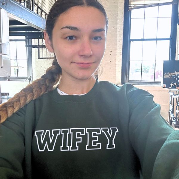 Dark green 'Wifey' sweatshirt with bold white lettering.