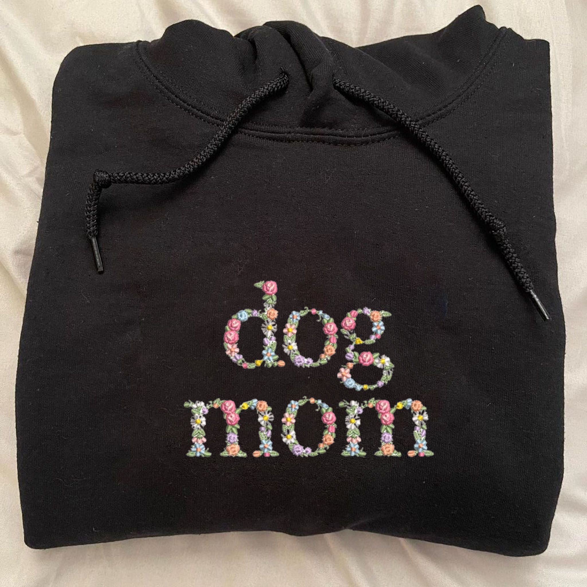 https://embroly.com/cdn/shop/products/custom-embroidered-dog-mom-hoodie-with-icon-gift-for-dog-owners_4_5000x.jpg?v=1681264743