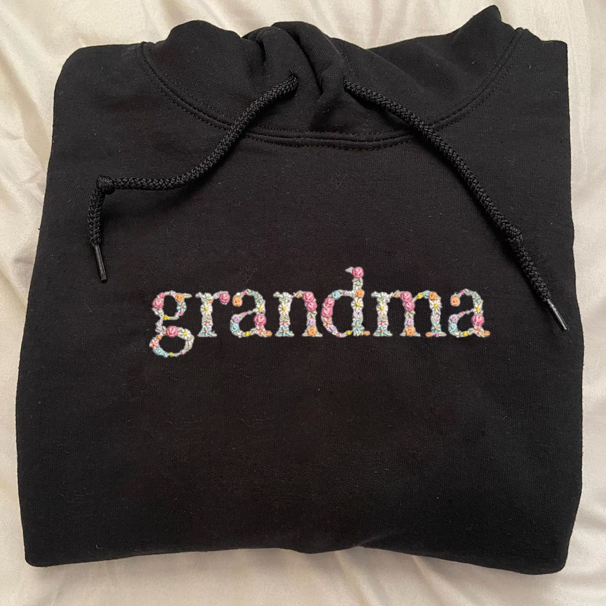 https://embroly.com/cdn/shop/products/custom-grandma-hoodie-embroidery-hoodie-flower-letter-gifts-for-grandparents_4_5000x.png?v=1681266545